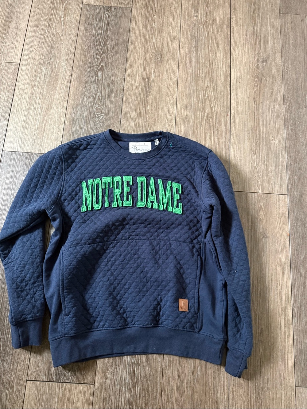Pressbox Navy Quilted Crewneck with Green Notre Dame Appliqué